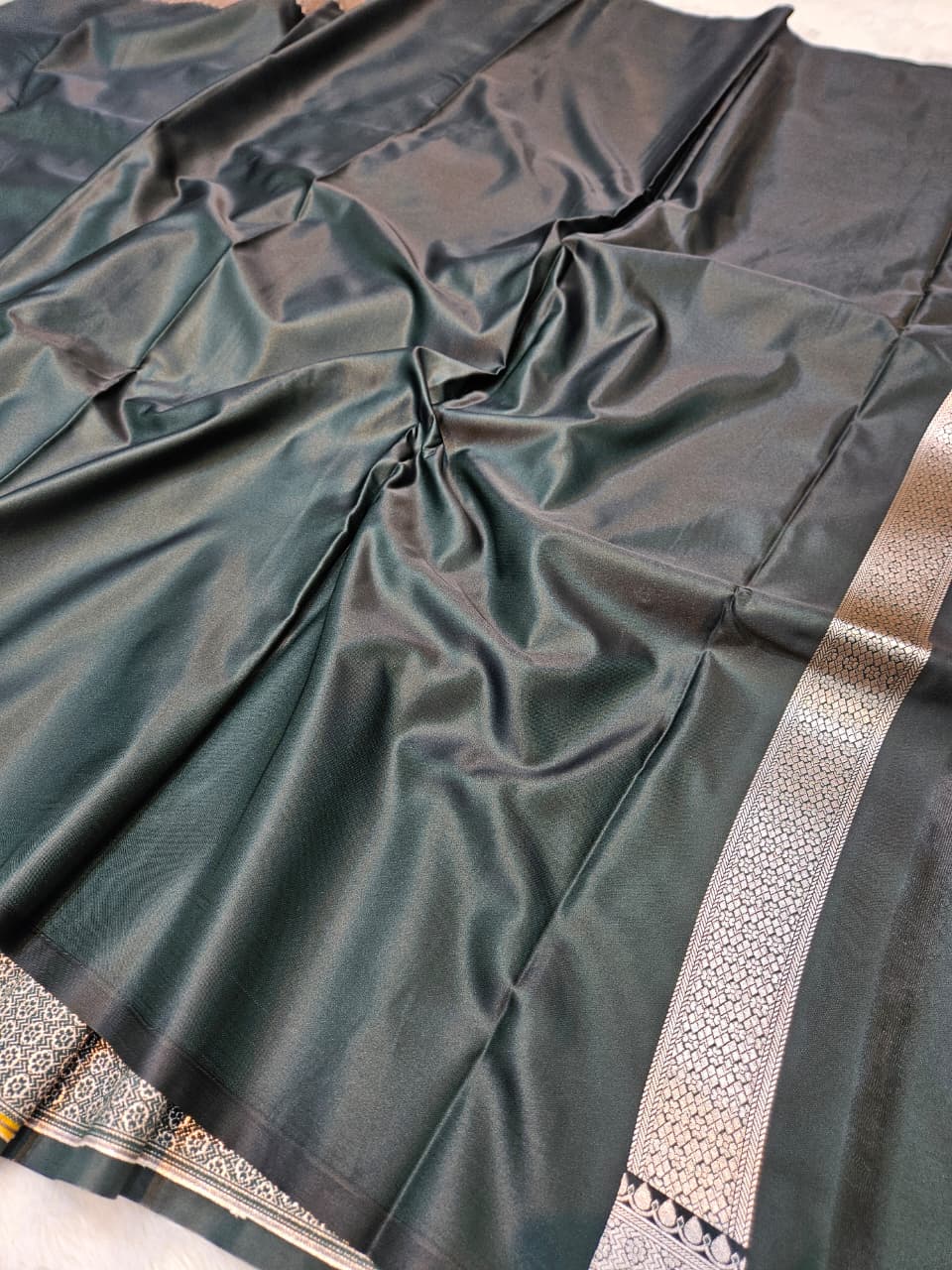 Black Mashru Katan Satin Silk Saree with a Tilfi Minakari Aanchal and Plain Body.